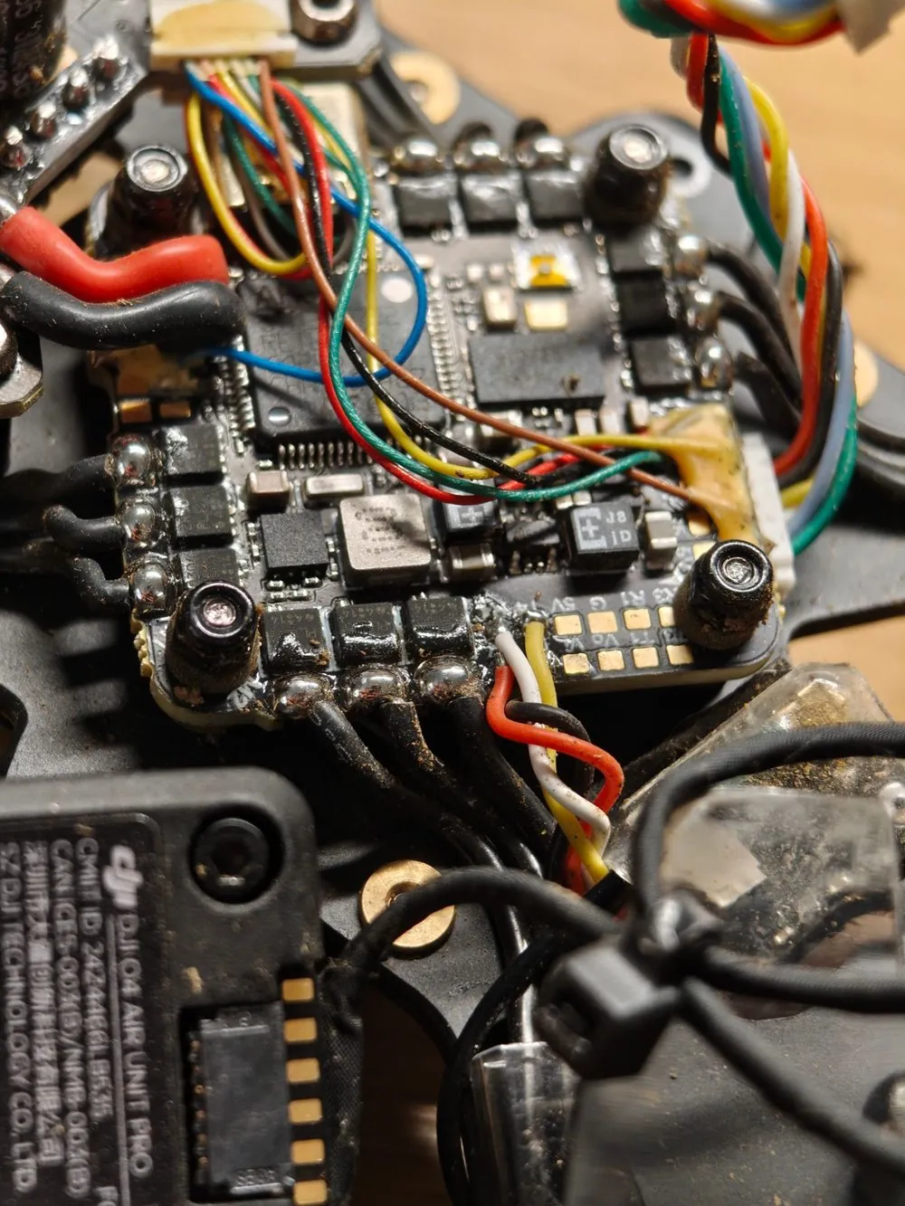 Close-up of hand-soldered flight controller wiring