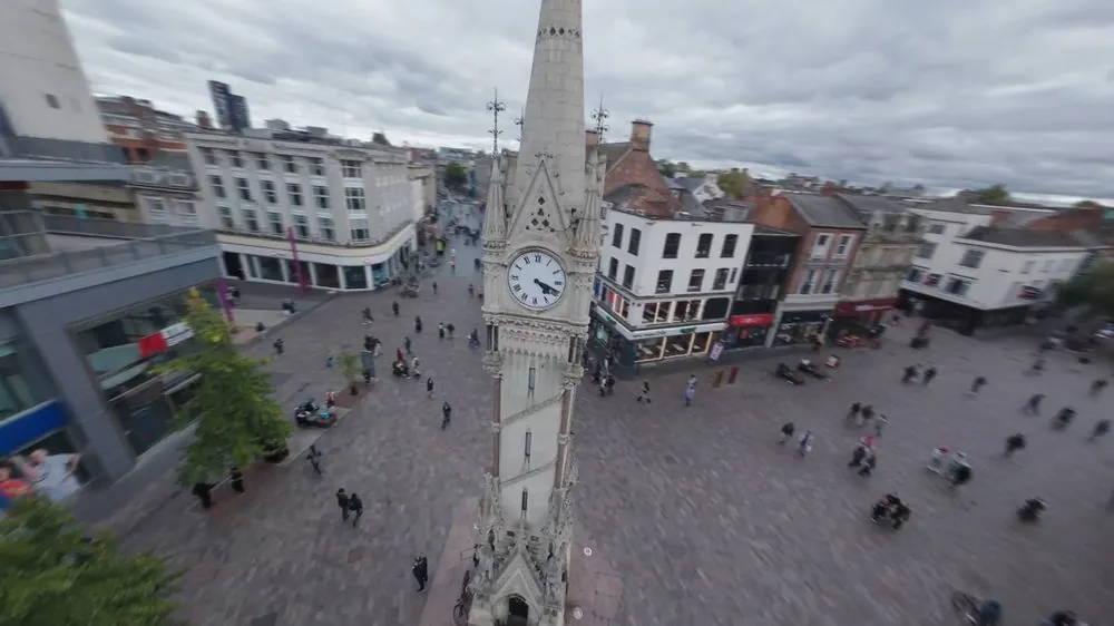 Aerial view of a clock tower and town square